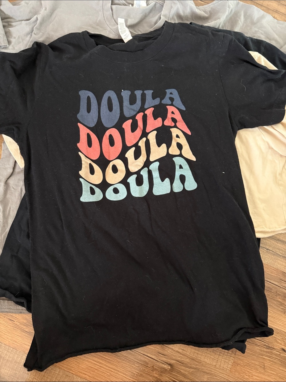 Bella Canvas Black Tee with Multicolor 'Doula' Stack Graphic
